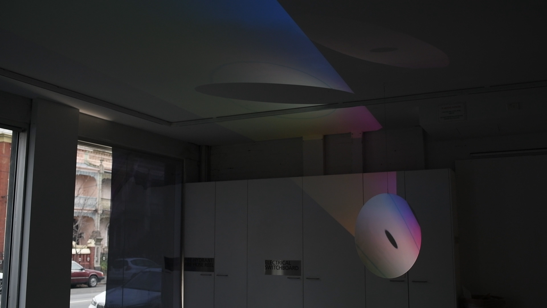 kinetic sculpture, acrylic disc approx 60 cms with video projection - self automated motion