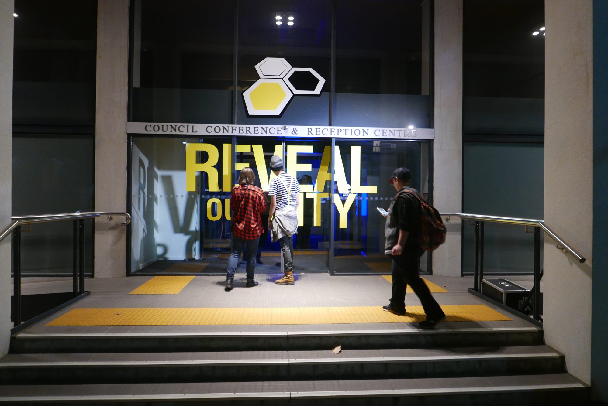 The entrance to the Council Conference and Reception Centre, Geelong City Hall, with the Reveal our City sign and Beehive logo