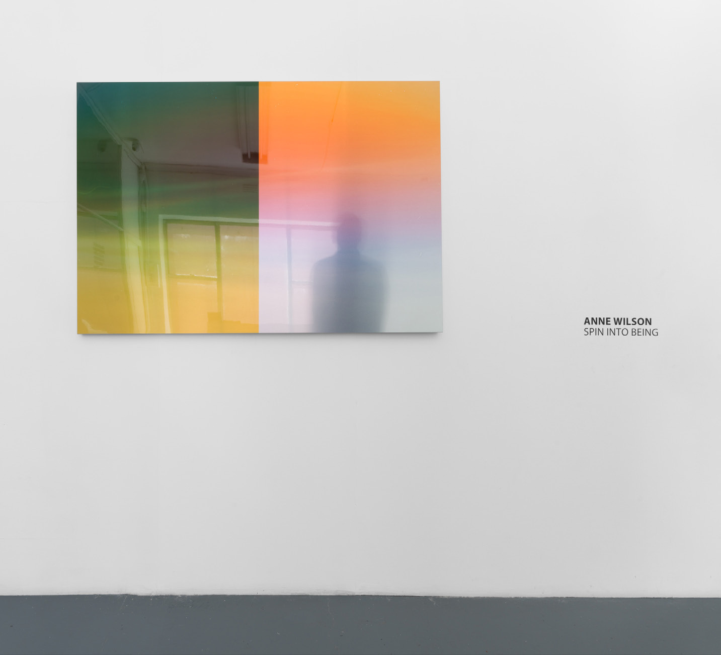 Installation view of Spin Into Being at Five Walls Gallery, showing immersive video projection with light refracting through bespoke screen across walls and ceiling